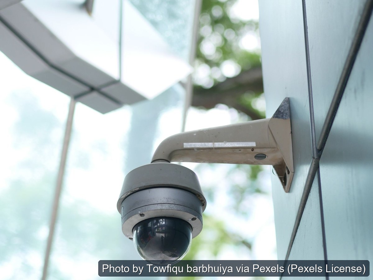 Dome security camera mounted on a building exterior