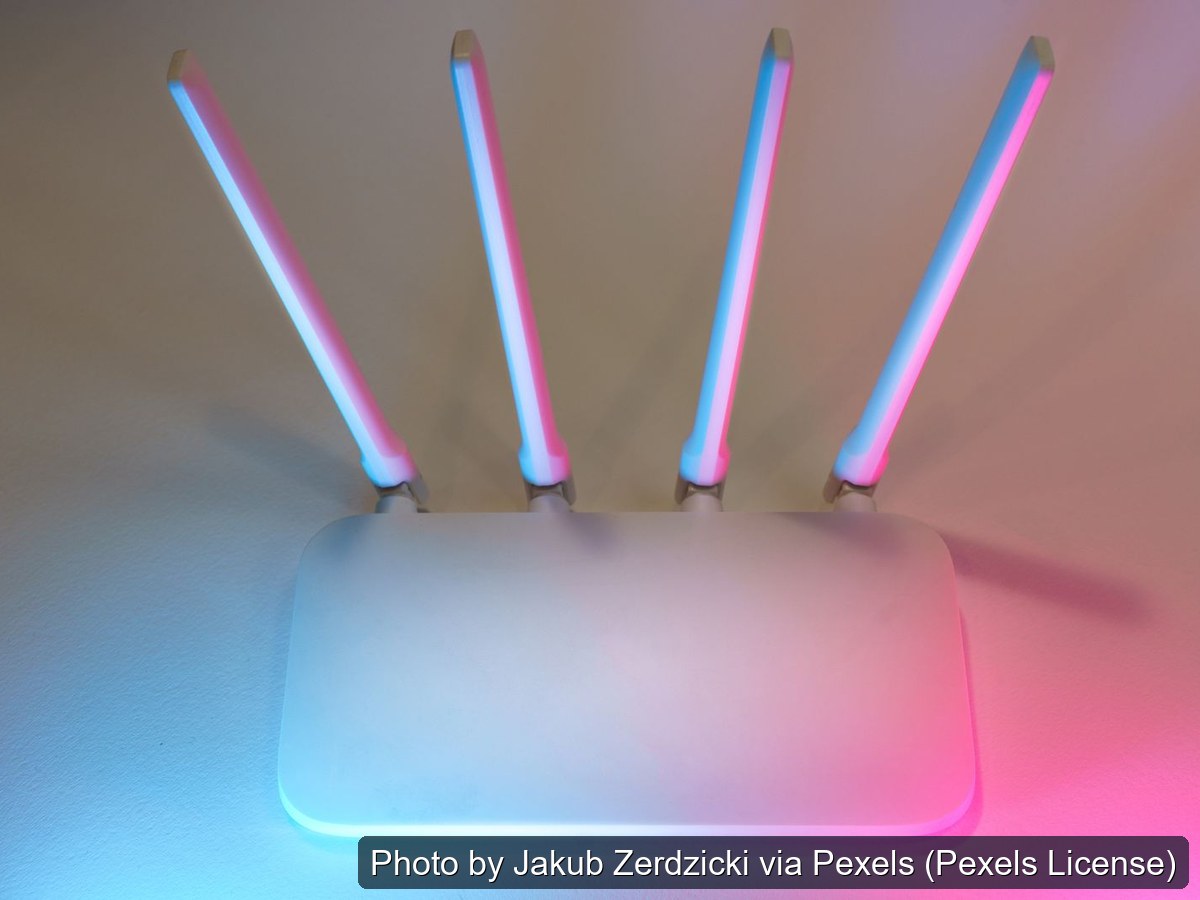 White four-antenna wireless router, front view