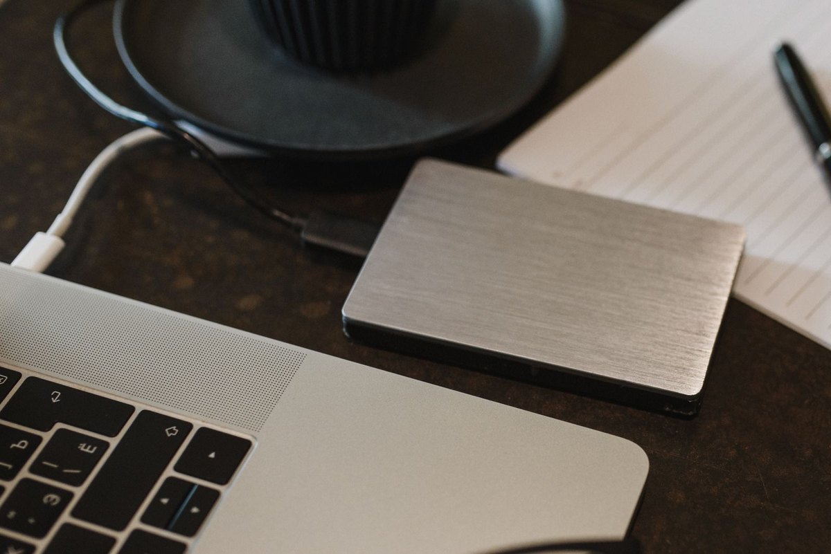 External hard drive connected to a laptop with a USB cable