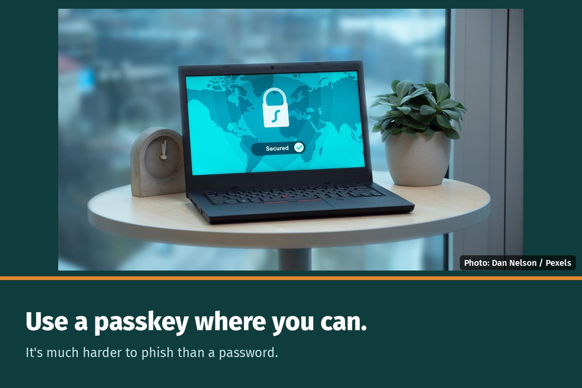 A laptop with a lock graphic, with the words "Use a passkey where you can. It's much harder to phish than a password."